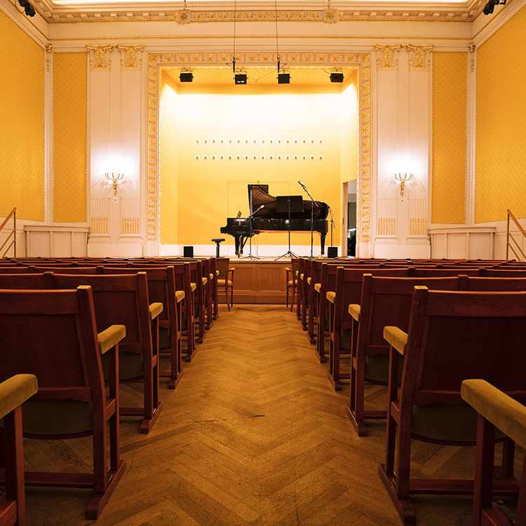 Look into the brightly light Schubertsaal with a concert piano standing on the stage